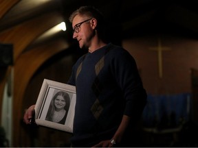 Rowan Greeve holds a photo of his mother Catherine Rose Greeve, murder August 3, 1988 in the Churchill LRT, following a candlelight service hosted by the Victims of Homicide Of Edmonton Support Society at Laurier Heights Baptist Church, in Edmonton Wednesday Dec. 13, 2023. The organization is a self-help/support group designed to offer emotional support and information about surviving the loss of a loved one to murder. Photo by David Bloom