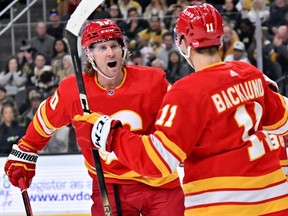 Calgary Flames forward Blake Coleman celebrates his goal against the Vegas Golden Knights with Mikael Backlund at T-Mobile Arena in Las Vegas on Saturday, Jan. 13, 2024.
