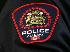 A Calgary police officer displays a shoulder flash on their uniform.
