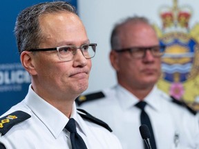 Deputy Chief Devin Laforce of the Edmonton Police Service talks about the ongoing extortion, arson and firearms series that has affected the South Asian community as Inspector Lance Parker, Organized Crime Branch listens. Taken on Thursday, Jan. 18, 2024 in Edmonton.
