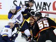 Calgary Flames goalie Jacob Markstrom battles St. Louis Blues forward Oskar Sundqvist at the Scotiabank Saddledome in Calgary on Tuesday, Jan. 23, 2024.