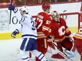 Toronto Maple Leafs forward Auston Matthews celebrates his hat-trick goal against netminder Dan Vladar and the Calgary Flames at the Scotiabank Saddledome in Calgary on Thursday, Jan. 18, 2024.