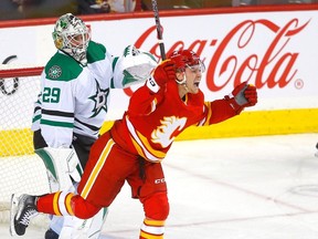 Calgary Flames forward Connor Zary celebrates after scores his first NHL goal, against Dallas Stars netminder Jake Oettinger at the Scotiabank Saddledome in Calgary on Nov. 1, 2023.
