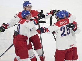 Czechia's Tomas Cibulka (7) celebrates his goal over Canada with teammates during first period quarterfinal hockey action at the IIHF World Junior Hockey Championship in Gothenburg, Sweden, Tuesday, Jan. 2, 2024.