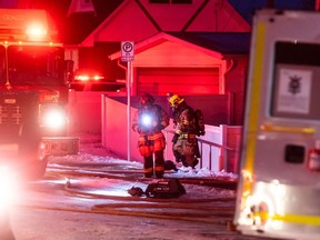 Emergency crews work around the scene of a house fire on Seymour Ave. SW on Sunday, January 28, 2024.