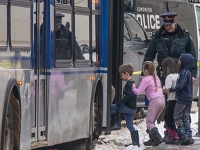 A grade one class was evacuated from city hall onto a city bus as police cleared the building. One person was arrested after gunshots were fired inside Edmonton city hall, and a molotov cocktail thrown from the second floor. No injuries reported on Jan.23, 2024. Photo by Shaughn Butts-Postmedia