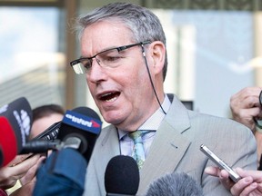 Omar Khadr's lawyer Dennis Edney speaks to media in Edmonton on May 7, 2015. The well-known Canadian lawyer who played a critical role in the release of Khadr, who was detained as a teen in Guantanamo Bay, has died.