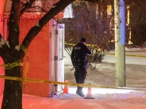 Calgary police officers investigate a crime scene near an apartment complex on 36th Avenue S.W. on Wednesday, January 10, 2024.