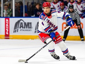Hunter Brzustewicz, a high-scoring blue-liner for the Ontario Hockey League’s Kitchener Rangers, was traded to the Calgary Flames as a key piece in the return package for Elias Lindholm.