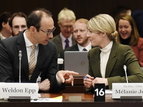 Foreign Affairs Minister Melanie Joly speaks with senior Global Affairs Canada official, Weldon Epp before appearing at committee, Wednesday, March 22, 2023 in Ottawa. "How India defines extremism or even terrorism does not always compute in our legal system," Epp told MPs this month.