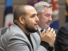 Calgary Ward 8 Coun. Courtney Walcott poses questions to administration in council chamber at Calgary City Hall on Tuesday, January 30, 2024.