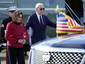 President Joe Biden escorts Rep. Nancy Pelosi, D-Calif., from Marine One to attend a fundraiser in San Francisco, Wednesday, Feb. 21, 2024.