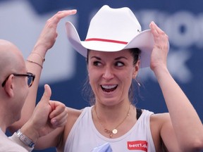 Sabine Lisicki of Germany receives a cowboy hat after defeating Stacey Fung of Canada in the women’s singles final at the Calgary National Bank Challenger on Nov. 12, 2023.