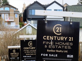 The Calgary Real Estate Board (CREB) says February home sales were up near 23 per cent from last year as new listings rose. This file images shows signs advertising homes for sale in Bridgeland on Tuesday, May 4, 2021.