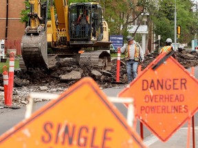 Crews work on the 124 Street Renewal Project site ( along 124 Street near 113 Avenue), in Edmonton Tuesday May 16, 2023.