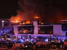 Emergency services vehicles outside the burning Crocus City Hall concert hall following a mass shooting incident in Krasnogorsk, outside Moscow, on March 22, 2024.