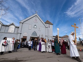 The Way of the Cross procession at Our Lady of Fatima Parish south of Dover Glen on April 7, 2023.