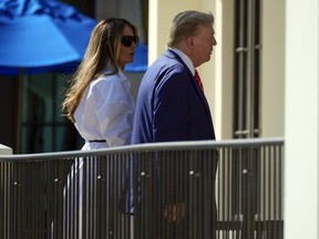 Republican presidential candidate former President Donald Trump and former first lady Melania Trump arrive to vote in the Florida primary election in Palm Beach, Fla., Tuesday, March 19, 2024.