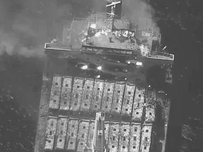 This black-and-white image released by the U.S. military's Central Command shows the fire aboard the bulk carrier True Confidence after a missile attack by Yemen's Houthi rebels in the Gulf of Aden on Wednesday, March 6, 2024. A missile attack by Yemen's Houthi rebels on a commercial ship in the Gulf of Aden on Wednesday killed three of its crew members and forced survivors to abandon the vessel, the U.S. military said. It was the first fatal strike in a campaign of assaults by the Iranian-backed group over Israel's war on Hamas in the Gaza Strip.
