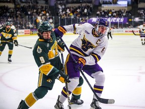 College standout Sam Morton, right, has signed a contract with the Calgary Flames for the 2024-25 campaign. (Photo by Kenzie Schmidt, courtesy of Minnesota State Mavericks)