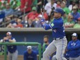 Toronto Blue Jays’ Joey Votto hits a solo home run off Philadelphia Phillies starter Zack Wheeler at BayCare Ballpark, Sunday, March 17, 2024, in Clearwater, Fla.