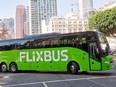 A FlixBus moves through the downtown of an American city in an undated photo.