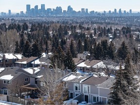 Starting Monday, Calgary city council will hear from residents at public hearings about proposed blanket rezoning. Pictured here are suburban houses with Calgary's downtown skyline in the background, as seen on Wednesday, March 22, 2023.