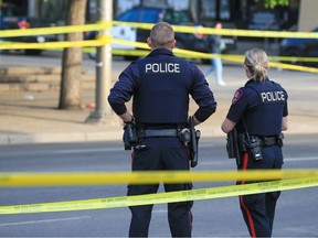 Police guard the scene of a fatal stabbing at Olympic Plaza on Thursday, May 25, 2023.