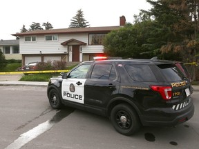Police investigate the scene on 29th Street N.W. where a woman's body was discovered early Friday, June 30, 2023.