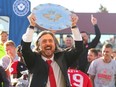 Cavalry FC GM/head coach Tommy Wheeldon Jr. hoists the Canadian Premier League Shield as the club celebrates its regular-season title on ATCO Field at Spruce Meadows on Oct. 7, 2023.