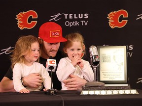 Calgary Flames forward Blake Coleman, joined by his daughters Charlie and Carson, accepts the Peter Maher Good Guy Award for the 2023-24 season.