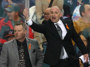 Calgary Roughnecks head coach Josh Sanderson makes a point behind the bench during a game in February.