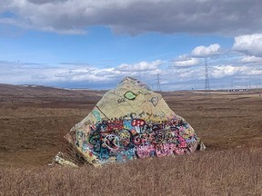 A glacial erratic in Calgary's Nose Creek valley is a frequent target of vandalism.