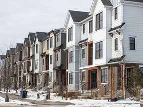 New townhomes line a street in the Alpine Park neighbourhood of Calgary on Wednesday, March 27, 2024.