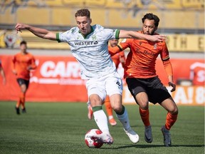 Cavalry FC defender Daan Klomp looks to control the ball during a match against Forge FC at Tim Hortons Field in Hamilton on Saturday, April 13, 2024.