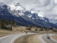 Traffic travels along the Trans-Canada Highway past Mount Rundle of the Rocky Mountains near Canmore, Alta., Monday, April 24, 2023. Documents released under Alberta Freedom of Information laws confirm the United Conservative government was talking with the coal industry for "years" about relaxing a policy that protected the Rocky Mountains from open-pit mines.