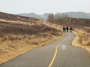Walkers enjoy the pathway through Glenbow Ranch Provincial Park on Wednesday, December 1, 2021.