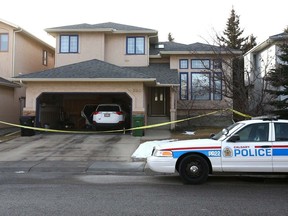 Calgary police contain a house in 200 block of Edgepark Way N.W. in Calgary on Thursday, January 10, 2019, where a man was found dead.