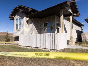 Police tape surrounds a home on Prestwick Terrace S.E. in Calgary on Tuesday, April 9, 2024, where a person was killed the day prior.