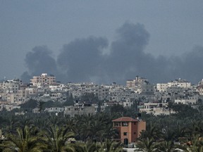 Smoke billows following an Israeli bombardment north of Nuseirat in the central Gaza Strip on April 27, 2024.