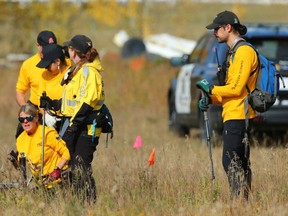 Calgary search and rescue teams and Calgary police are shown at a residence east of Chestermere on Tuesday, October 3, 2023. The search was related to the shooting death of Jordan Jacques-Vetten in Calgary in September 2023.