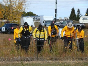Calgary Search and Rescue teams and Calgary police at a residence east of Chestermere on Tuesday, October 3, 2023.