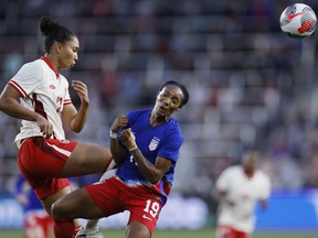 Canada's Jade Rose, left, kicks the ball away from United States' Crystal Dunn during the first half of a SheBelieves Cup soccer match Tuesday, April 9, 2024, in Columbus, Ohio.