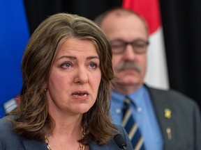 Premier Danielle Smith and Minister of Municipal Affairs Ric McIver talk about legislation they will introduce introduce addressing agreements between the federal government and provincial entities on Wednesday, April 10, 2024 in Edmonton.