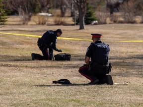 Police investigate the scene of a 2022 homicide near an Edmonton high school.