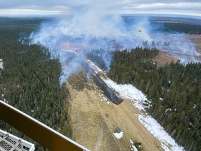 A wildfire burns near Edson, Alta. in this Tuesday, April 16, 2024, handout photo. A natural gas pipeline owned by TC Energy Corp. ruptured near Edson, Alta. on Tuesday afternoon, sparking a wildfire.
