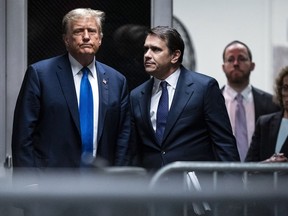 Former President Donald Trump and attorney Todd Blanche return from a lunch break in his trial at Manhattan criminal court in New York on Thursday, April 18, 2024.