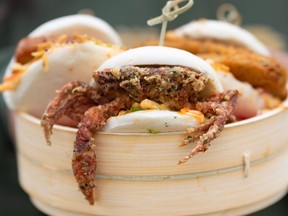 Pictured is The Dumpling Hero?s Holy Bao, including one soft shell crab Bao, one pork belly Bao, and one deep fried pickle Bao, at the 2023 Calgary Stampede midway food launch.