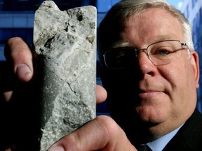 This 2007 photo shows Peter Macaulay holding up a core sample from the Bre-X mine site, a keepsake from when he was the lead investigator in the Bre-X Gold case 10 years earlier.