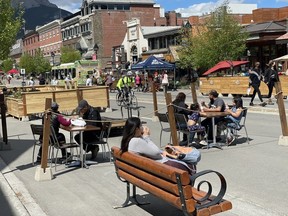 Banff Avenue busy with open patios and visitors on June 12, 2021.